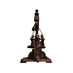 Royal wooden jhula swing with finely carved wooden pillars and detailed traditional craftsmanship