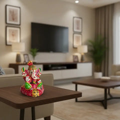 Hand-painted Ganesha idol with red Meenakari work and lion base, traditional Indian decorative figurine