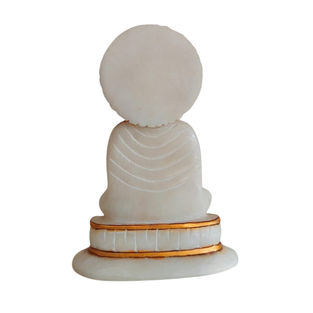 Artisan-carved white marble Buddha with hand-painted gold details.