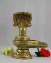 Brass Shivalingam with Serpent Hood – Spiritual Idol for Worship