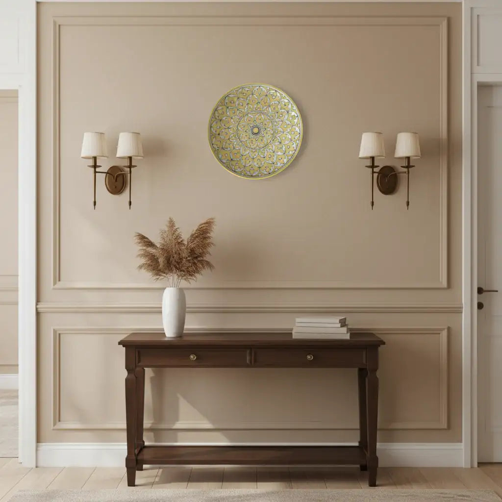 Round decorative item with intricate gold pattern on a white background