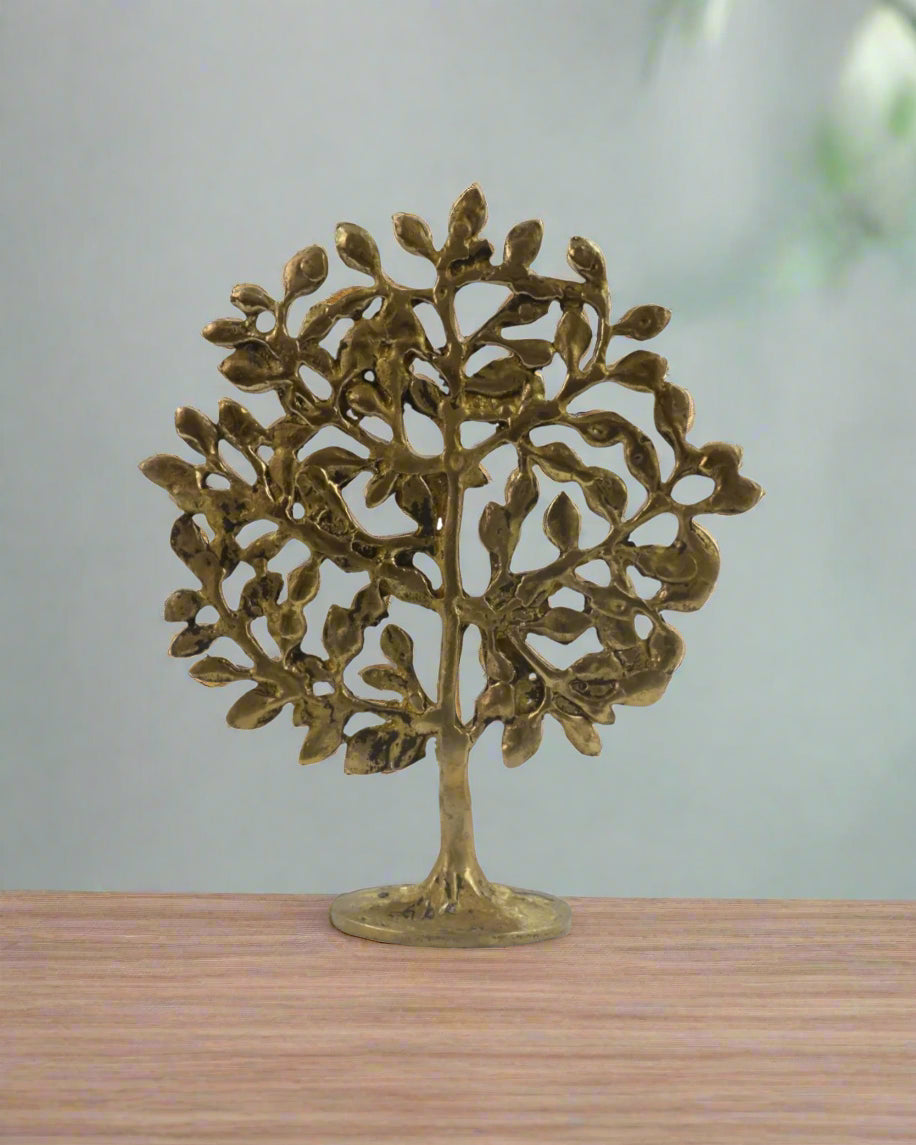 Decorative brass tree sculpture on a white background with 'Krafteria' branding.