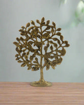 Decorative brass tree sculpture on a white background with 'Krafteria' branding.
