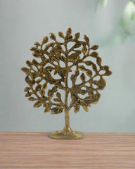 Decorative brass tree sculpture on a white background with 'Krafteria' branding.