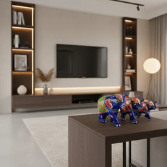 Set of 3 hand-painted wooden elephant family figurines in royal blue with intricate Indian folk art detailing