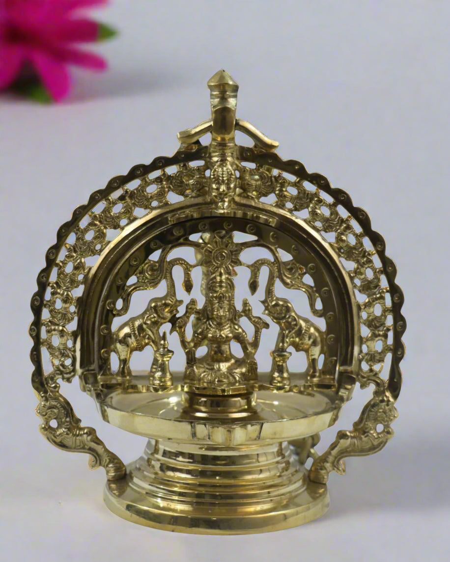 Bronze Hanging Deepam Decorative brass lamp with intricate design on a white background