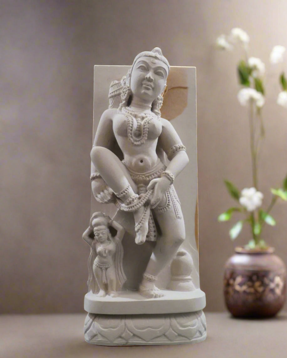 White stone statue of a seated figure with intricate detailing on a white background, branded 'Krafteria'.