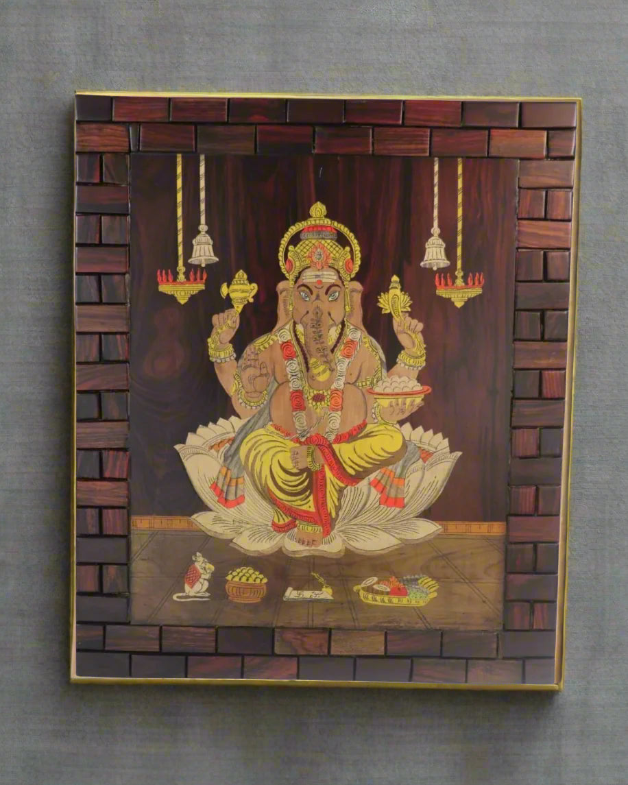 Decorative wall art of a seated figure with intricate details in a wooden frame.