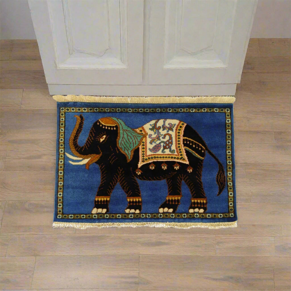 Decorative rug with an elephant design on a wooden floor.