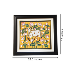 Pichwai Framed artwork of a cow among flowers with dimensions indicated
