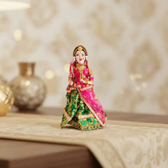 Handcrafted traditional Indian bride doll figurine dressed in vibrant bridal attire with intricate detailing