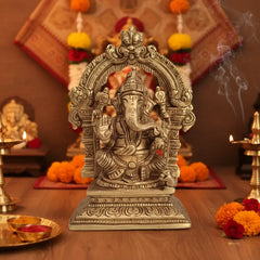 Brass Lord Ganesha Idol with Prabhavali Arch and Elaborate Pedestal Brass Ware