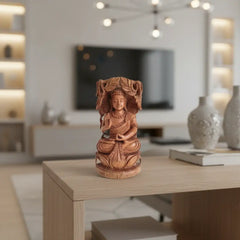 Reversible hand-carved wooden statue depicting a meditating Buddha on one side and an intricate Bodhi Tree design on the other, against a light background.
