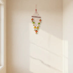 Vibrant hand-painted clay and metal bell wind chime wall hanging with colorful traditional Indian folk art design