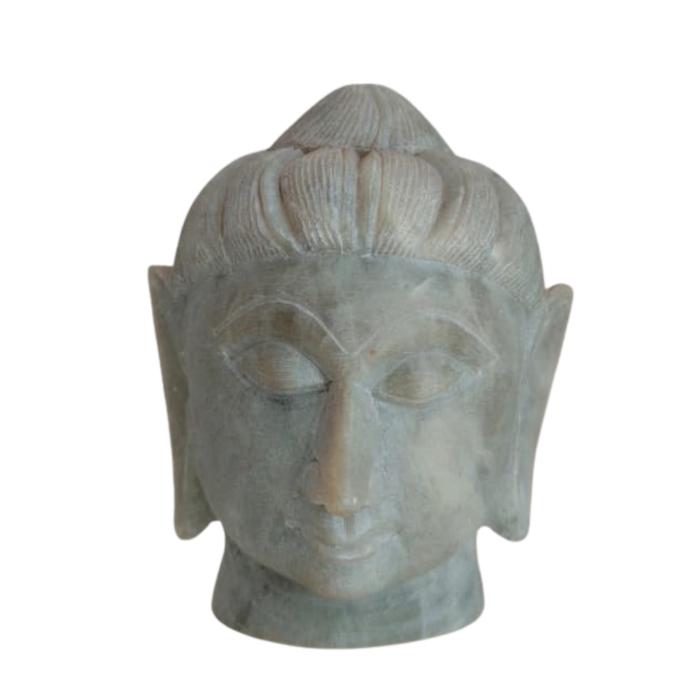 Handcrafted marble Buddha face idol with serene expression.