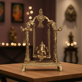 Unique Brass Lord Ganesha on Swing (Jhula): Idol of Joy, Playfulness, and Auspiciousness Brass Ware