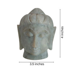 Peaceful Buddha head sculpture carved from natural marble.