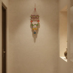 Hand-painted Indian parrot and bell wind chime wall hanging with colorful wooden parrots and metal bells