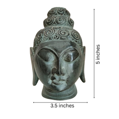 Contemporary white marble Buddha face art piece.