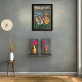 Decorative wall art with a clock and small table with a vase on a gray wall.