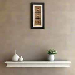 Miniature Painting Framed artwork above a white shelf with decorative vases and a small plant on a beige wall.