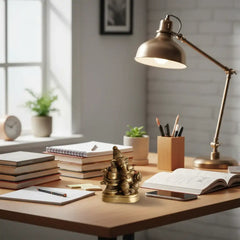 Brass idol showing Lord Shiva seated with his son, Lord Ganesha, seated near him, symbolizing the divine father-son bond.