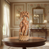 Hand-carved wooden Salabhanjika celestial maiden sculpture standing under a fruiting tree with intricate detailing