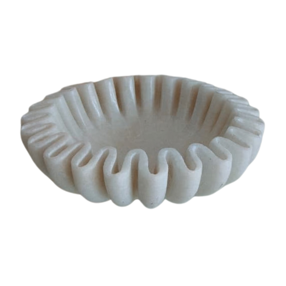 Handcrafted marble bowl featuring scalloped ruffle edges.