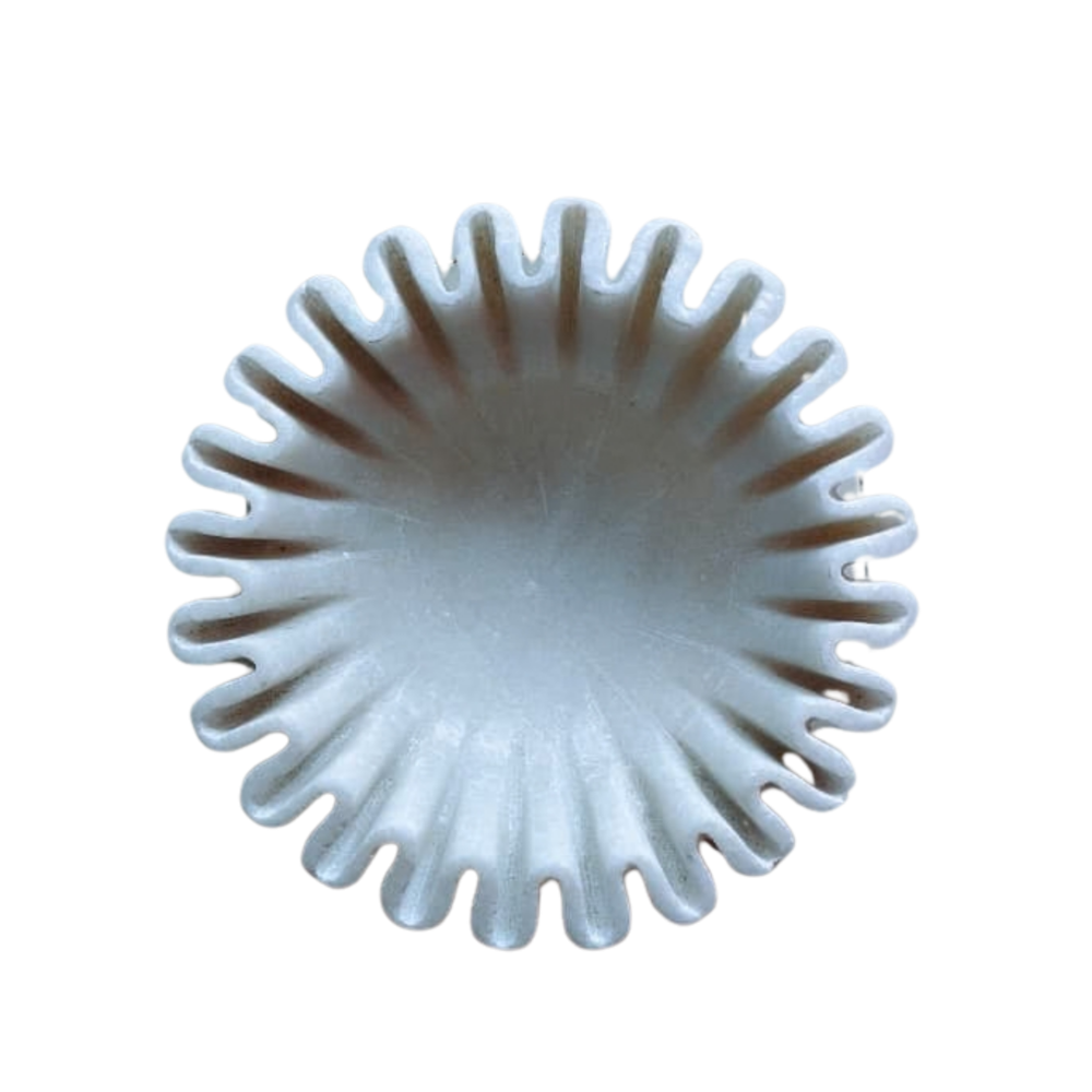 Luxury marble centerpiece bowl with soft wavy rim detailing.