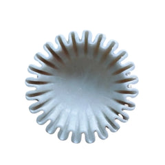Luxury marble centerpiece bowl with soft wavy rim detailing.