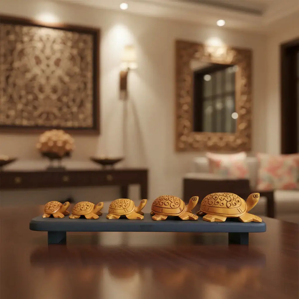 Hand-carved wooden turtle family sculpture displayed on wooden base symbolizing harmony and longevity