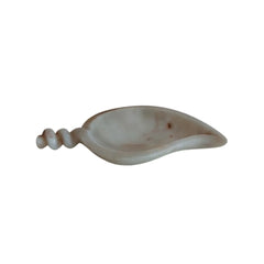 Artisan-carved marble urli with smooth polished finish.
