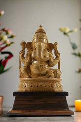 Wooden statue of Ganesha on a white background with 'Krafteria.com' branding.