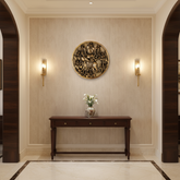 Detailed brass wall hanging showcasing Goddess Durga riding a buffalo, surrounded by other deities, depicting the Mahishasuramardini scene.