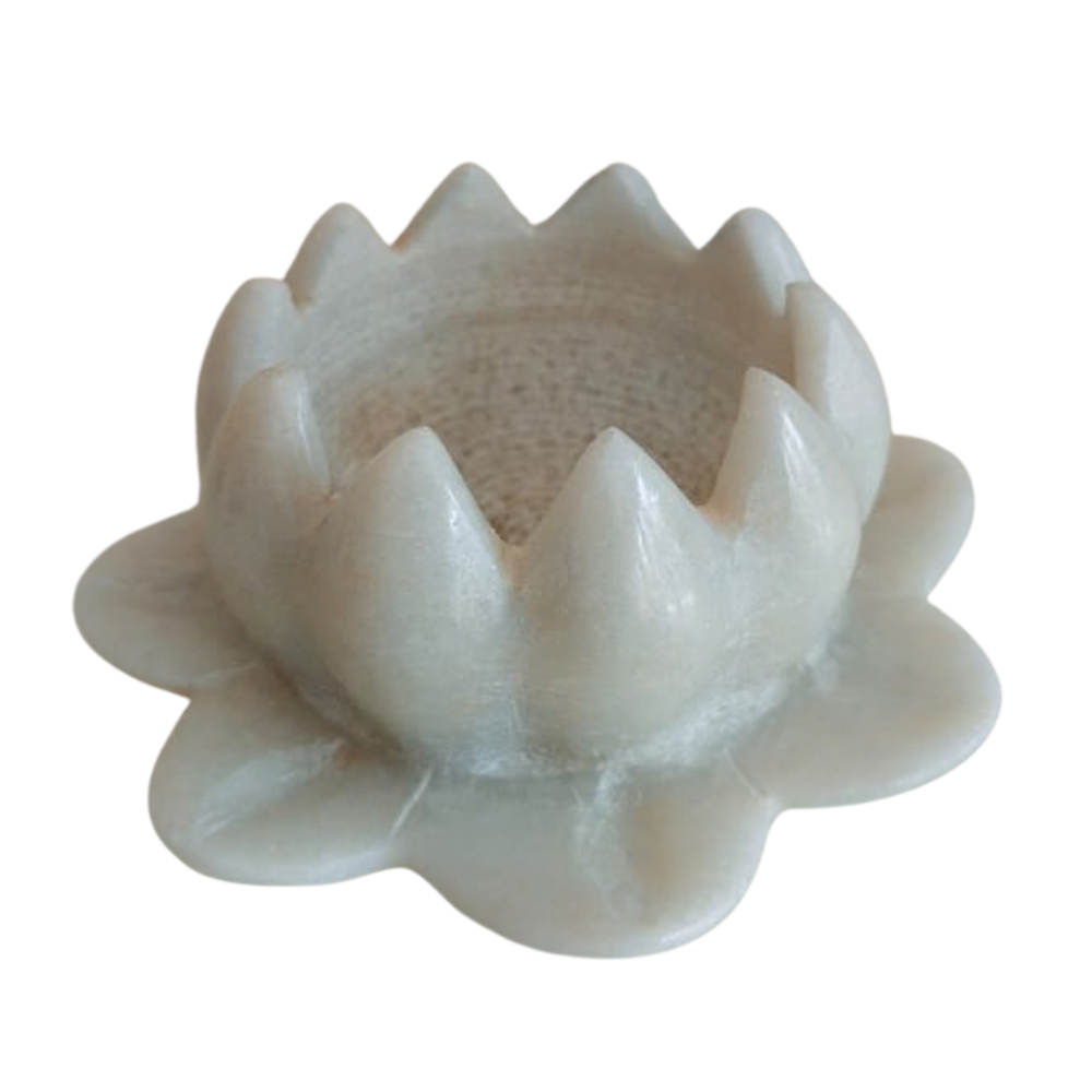 Natural marble lotus diya holder for spiritual ambiance.