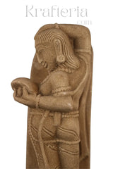 A Lady Adorning Herself with a Mirror Sand Stone