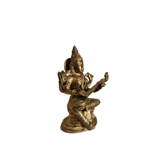 Handcrafted brass saraswati statue for pooja decor.