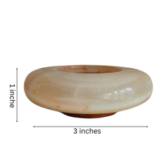 Decorative hexagonal onyx ashtray for table use.