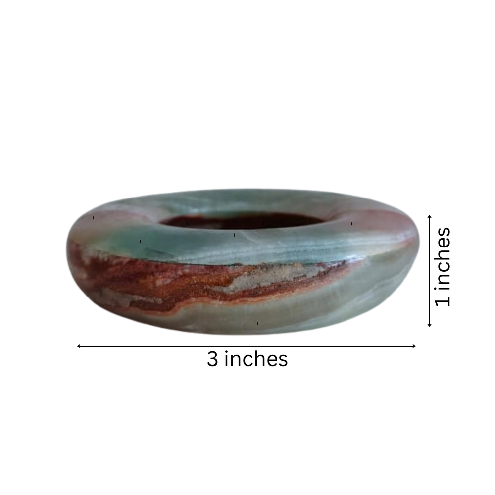 Solid onyx ashtray with deep center and cigarette rests.