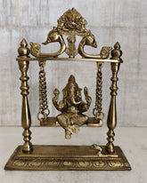 Exquisite brass Ganesha swing idol, handcrafted decorative art.
