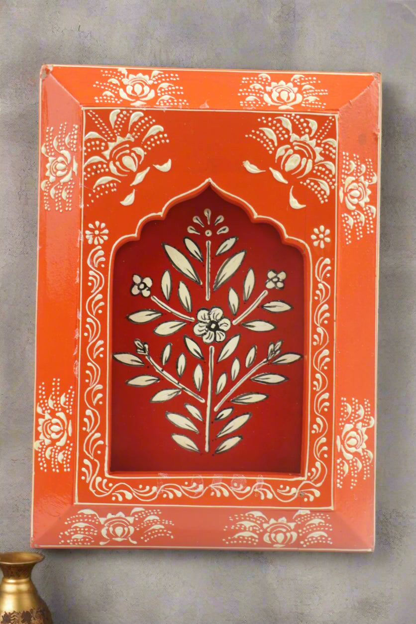 Decorative box with floral design on an orange background