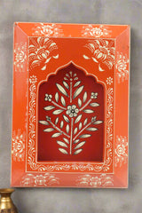 Decorative box with floral design on an orange background