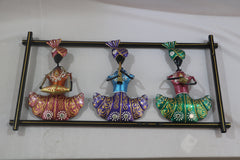 Decorative wall art with three colorful figurines on a white background