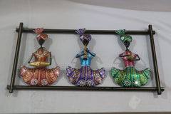 Decorative wall art with three colorful figurines on a white background