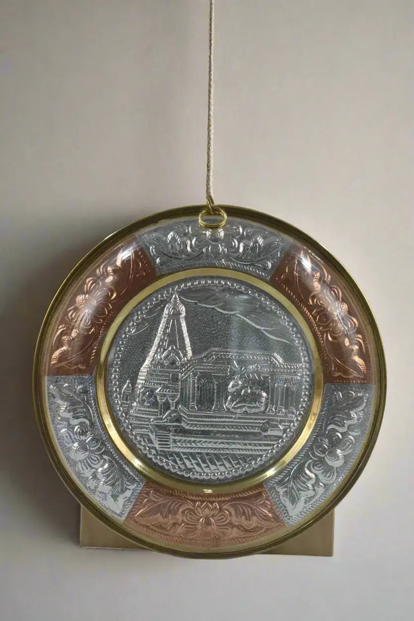 Decorative plate with intricate designs on a plain background