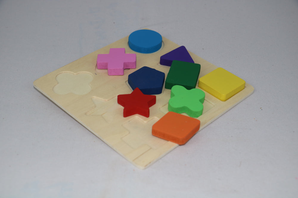 Colorful wooden shape puzzle on a light gray background