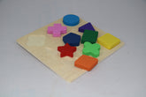 Colorful wooden shape puzzle on a light gray background