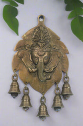 Elegant Brass Ganesha on Leaf With Bells – Spiritual Wall Hanging