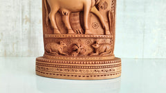 Intricate Cylindrical Wooden Carving with Ganesha and Sacred Cow Scenes