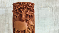 Intricate Cylindrical Wooden Carving with Ganesha and Sacred Cow Scenes